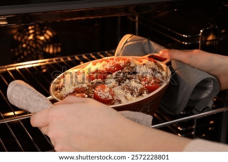 Similar – Image, Stock Photo Casserole is put in the oven