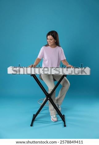 Similar – Image, Stock Photo Woman with modern synthesizer at home