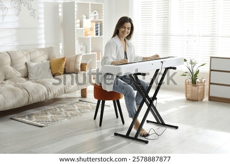 Similar – Image, Stock Photo Woman with modern synthesizer at home