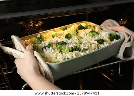 Similar – Image, Stock Photo Casserole is put in the oven