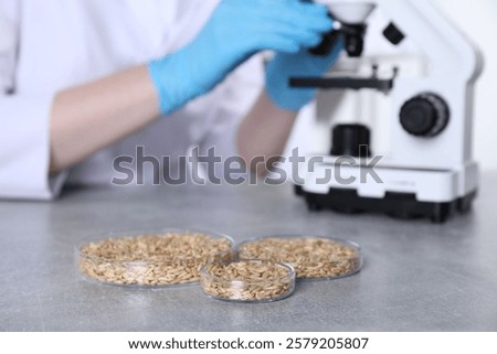 Similar – Image, Stock Photo Focused scientist examining chemical solution in laboratory