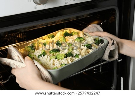 Similar – Image, Stock Photo Casserole is put in the oven