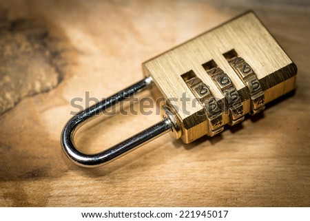 combination padlock on wood