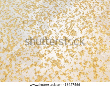 Gold dust texture on white rock has small  piles and clumps.