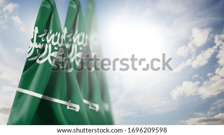  Close up waving flag of Saudi Arabia. National Saudi Arabia flag in the sky.