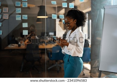 Similar – Black woman using mobile phone