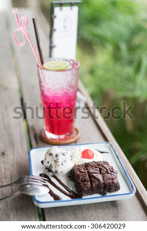 brownie with ice cream and Red soda