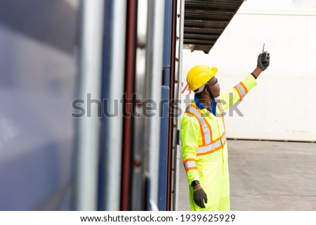 Foreman using mobile phone and laptop in the port of loading goods. Foreman on Forklifts in the Industrial Container Cargo freight ship. Zdjęcia stock © 