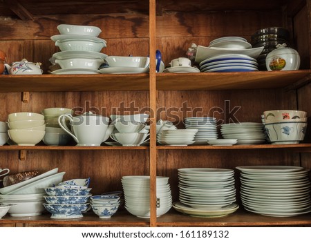 Wooden crockery in the pantry in the kitchen.