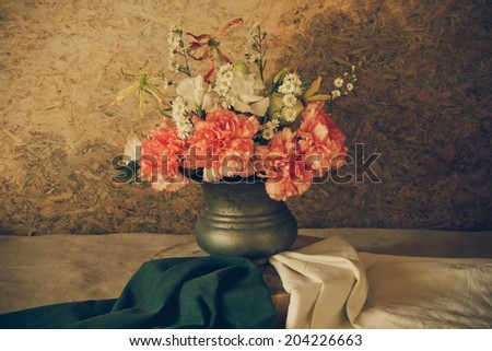 Still life with a Beautiful flowers in old vase, beautiful style.