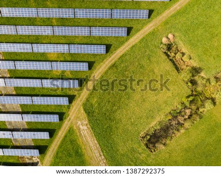 Similar – Foto Bild Droneshot einer Solarpanel-Farm erzeugt grünen Strom