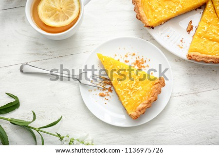 Similar – Image, Stock Photo Sliced lemon pie on blue background. Fruit tart slices