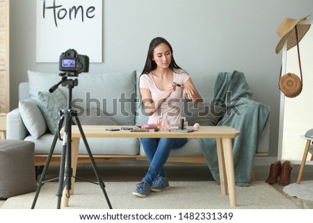 Similar – Image, Stock Photo Fashion blogger recording video at home