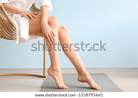 Woman with beautiful legs after depilation at home Imagine de stoc © 