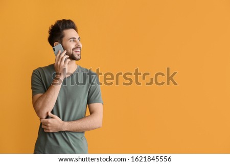 Similar – Image, Stock Photo Man talking on smartphone while browsing laptop