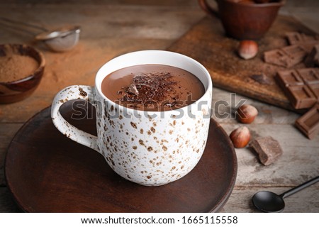 Similar – Image, Stock Photo A cup of cocoa with gingerbread cookies and a candy cane on a white table