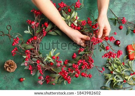 Similar – Image, Stock Photo Woman making Christmas wreath of spruce, step by step. Concept of florist’s work before the Christmas holidays.