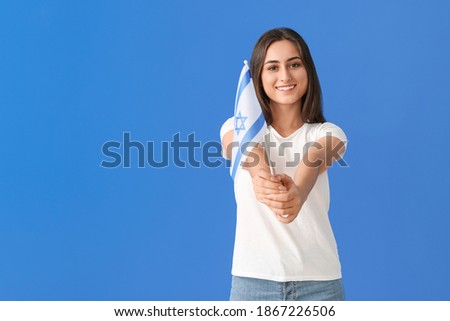 Young woman with the flag of Israel on color background Stok fotoğraf © 