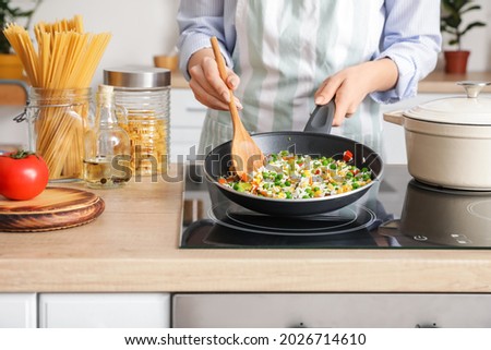 Image, Stock Photo Pan with rice and beans decorated with chopped green chilies and served on a wooden table