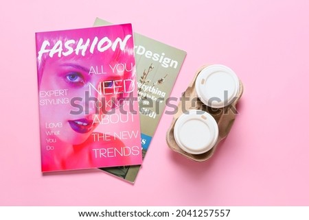 Takeaway cups for drink and magazines on color background Stock fotó © 
