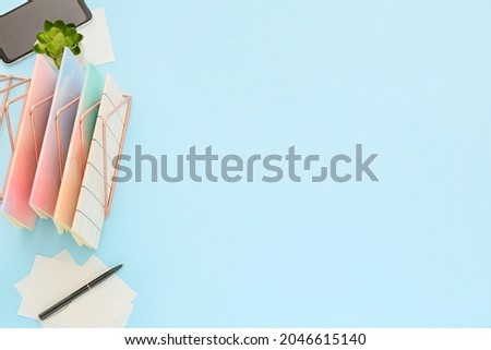 Composition with mobile phone and stationery on color background Stock fotó © 