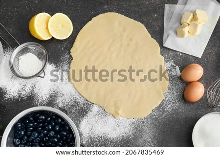 Similar – Foto Bild Blaubeerkuchen und Zutaten. Herstellung von Blaubeerkuchen mit Gitterkruste