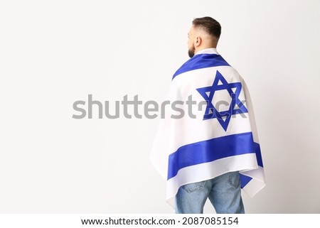 Man with the flag of Israel on light background Stok fotoğraf © 