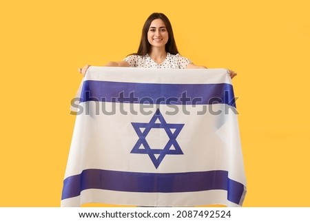 Young woman with the flag of Israel on color background Stok fotoğraf © 