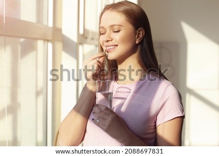 Similar – Image, Stock Photo young caucasian woman taking a picture of her golden retriever dog with mobile phone. Home, indoors