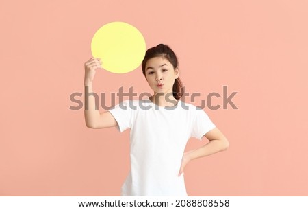 Little girl with blank paper sheet on color background 商業照片 © 