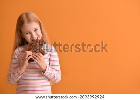 Similar – Image, Stock Photo Funny kid girl eating sandwich outdoors. Having fun. Looking at camera. Posing over nature background. Healthy food. Childhood.