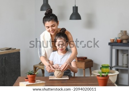 Similar – Foto Bild Kleine Tochter macht mit der Mutter zu Hause einen handgemachten Pompon