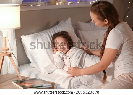 Similar – Image, Stock Photo Mom puts a child a mask and escorts to school or kindergarten. A boy with a masked backpack during a coronavirus. Side view