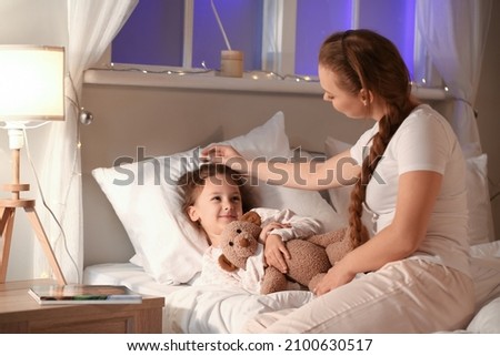 Similar – Image, Stock Photo Mom puts a child a mask and escorts to school or kindergarten. A boy with a masked backpack during a coronavirus. Side view
