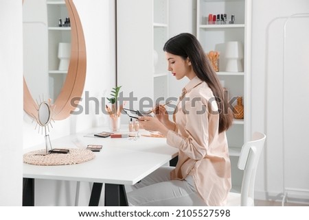 Similar – Image, Stock Photo Makeup artist doing makeup for young female artist