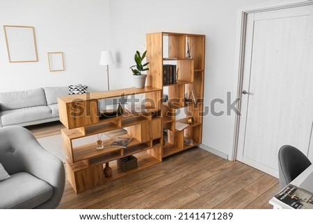 Wooden bookcase in interior of modern living room Foto d'archivio © 