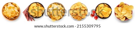 Bowl with different tasty potato chips on white background, top view Foto d'archivio © 
