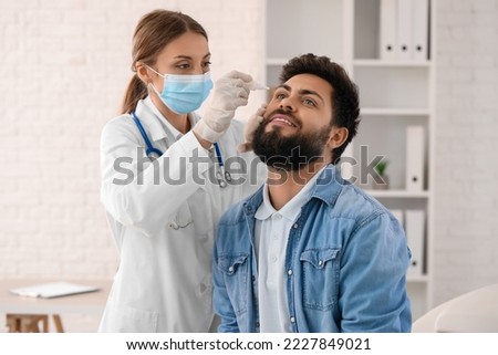 Similar – Image, Stock Photo caucasian doctor using protective gloves. Chinese Corona virus concept