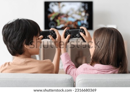 Similar – Image, Stock Photo Happy girl playing video games at night