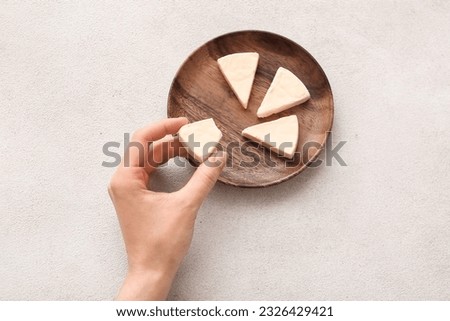 Similar – Image, Stock Photo hand holds a piece of white chalk on the background of an empty black chalk board, presentation concept