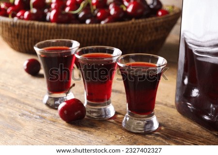 Similar – Image, Stock Photo a cherry liqueur and a beer on the pub table with tablecloth