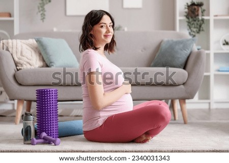 Similar – Image, Stock Photo Pregnant woman on yoga ball working out with elastic band