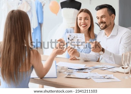 Similar – Image, Stock Photo Couple on their wedding apparel walking by the street