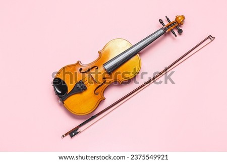 Similar – Image, Stock Photo Violin and bow in the hand of the musician in an empty room. Ban on performing in the Corona Crisis