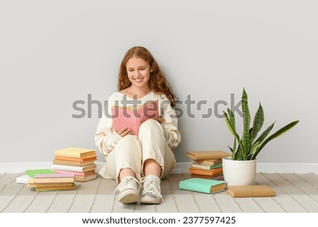 Similar – Image, Stock Photo Woman reading book near candles