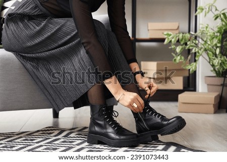 Image, Stock Photo Woman in stylish boots with red suitcase standing on road