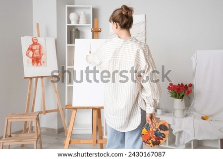 Similar – Image, Stock Photo Female artist painting on canvas in workshop