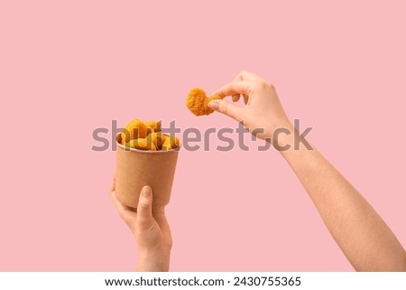 Similar – Image, Stock Photo hand holds a piece of white chalk on the background of an empty black chalk board, presentation concept