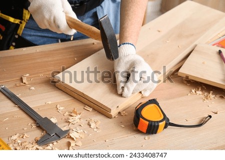 Similar – Image, Stock Photo Builder at work with wooden roof construction.