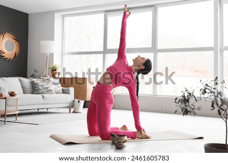 Similar – Image, Stock Photo Young woman stretching and breathing fresh air in middle of forest while exercising